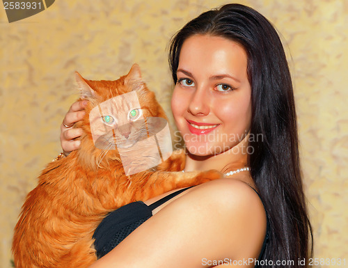Image of Young girl with a red cat