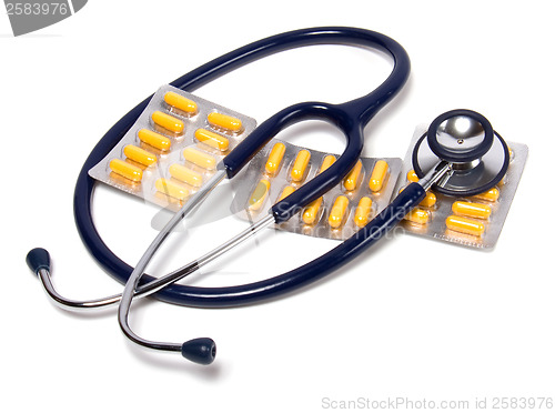 Image of stethoscope and tablets isolated on white background