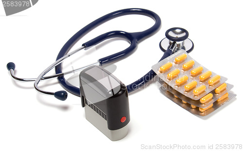 Image of stethoscope, tablets  and doctor seal isolated on white backgrou