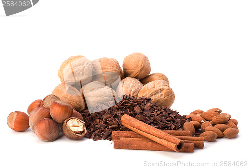 Image of grated chocolate and nuts isolated on white background