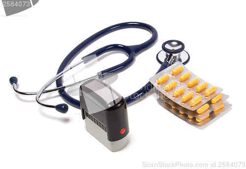 Image of stethoscope, tablets  and doctor seal isolated on white backgrou