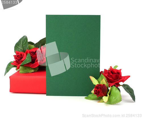 Image of Gift with floral decor. Flowers are artificial. 