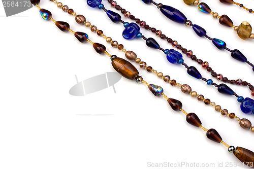 Image of colourful beads background on white 