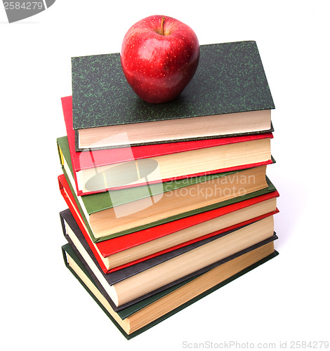 Image of book stack with apple isolated on white background 