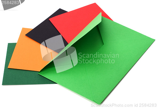 Image of green envelope with cards isolated on white background