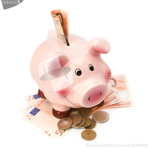 Image of Business concept. Lucky piggy bank isolated on white background.