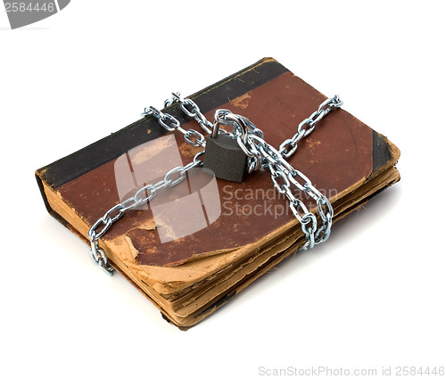 Image of tattered book with chain and padlock isolated on white backgroun