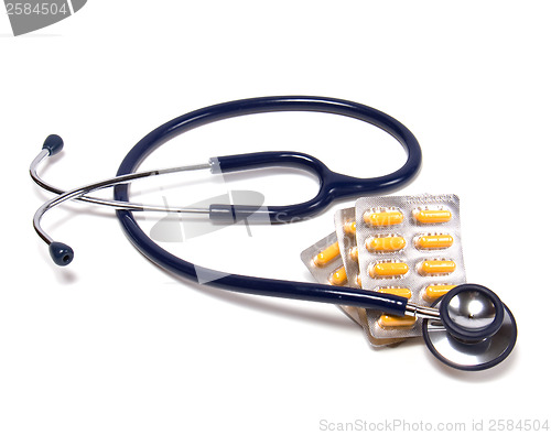 Image of stethoscope and tablets isolated on white background