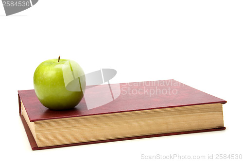 Image of book with apple isolated on white background 