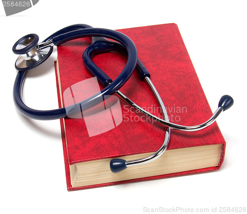 Image of stethoscope on red book isolated on white background