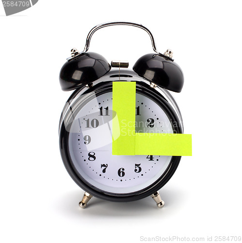 Image of Alarm clock with sticky paper 