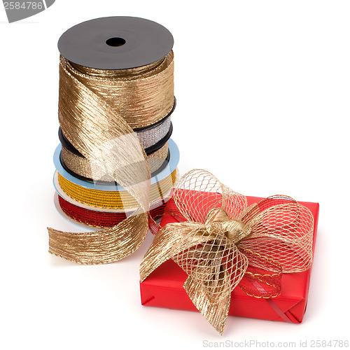 Image of Festive gift box and wrapping ribbons isolated on white backgrou