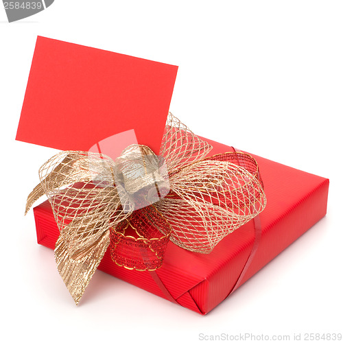 Image of Luxurious gift with note isolated on white background 