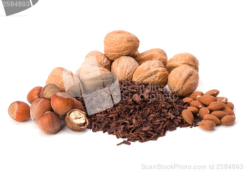 Image of grated chocolate and nuts isolated on white background