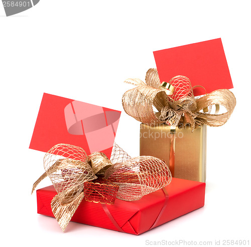 Image of 
Luxurious gifts with note isolated on white background 
