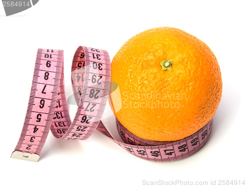 Image of  tape measure wrapped around the orange isolated on white backgr