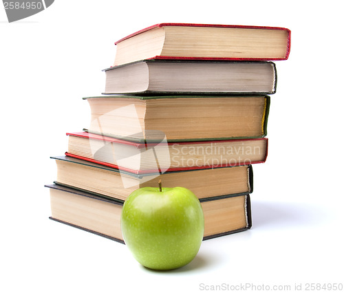 Image of book stack with apple isolated on white background 