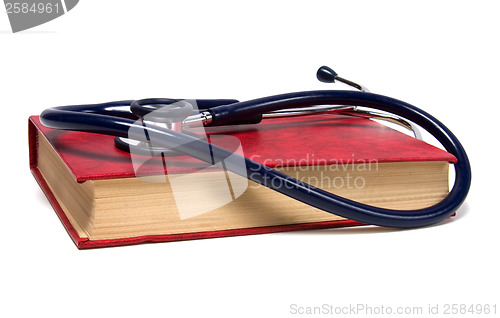 Image of stethoscope on red book isolated on white background