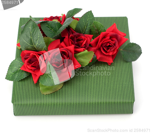 Image of Gift with floral decor. Flowers are artificial. 