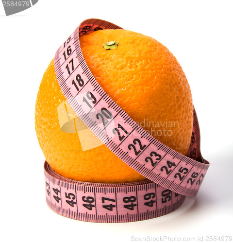 Image of  tape measure wrapped around the orange isolated on white backgr