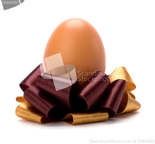 Image of easter egg with bow isolated on white background