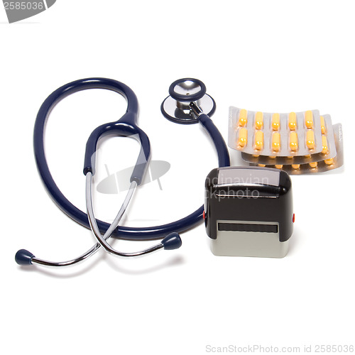 Image of stethoscope, tablets  and doctor seal isolated on white backgrou