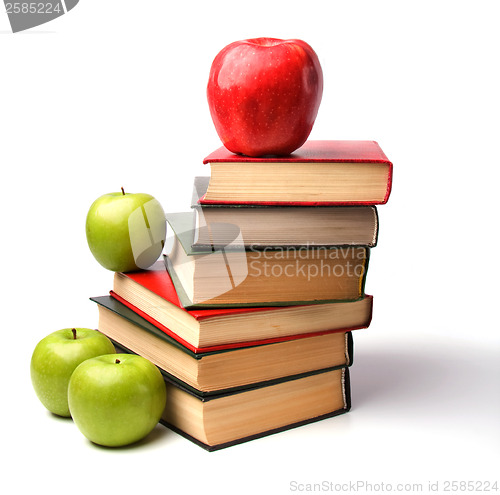 Image of book stack with apple isolated on white background 