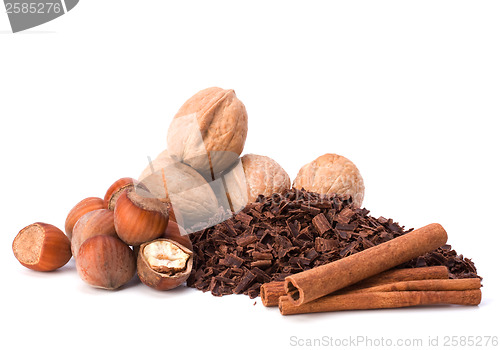 Image of grated chocolate and nuts isolated on white background