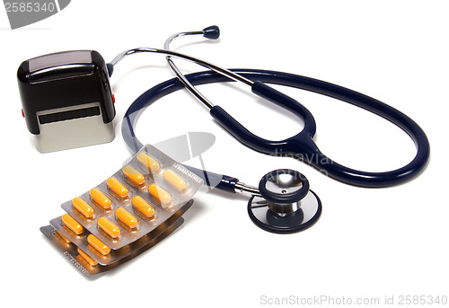 Image of stethoscope, tablets  and doctor seal isolated on white backgrou