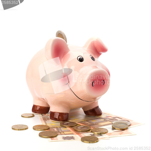 Image of Business concept. Lucky piggy bank isolated on white background.