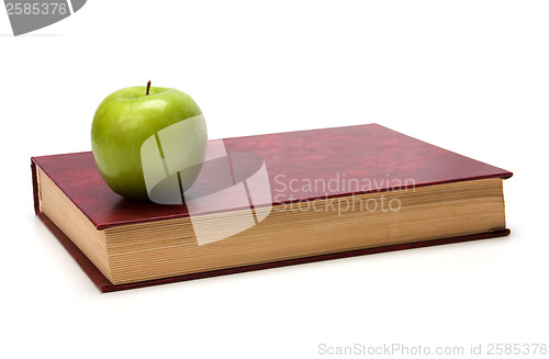 Image of book with apple isolated on white background 