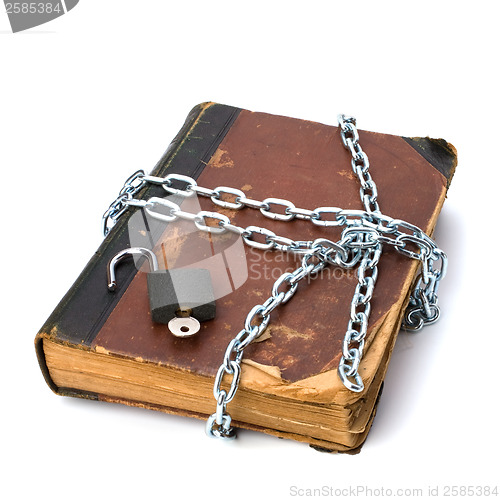 Image of tattered book with chain and padlock isolated on white backgroun