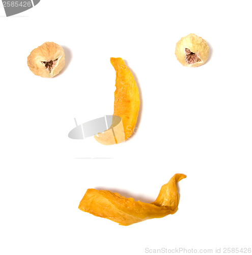 Image of human face imitation with dried fruits isolated on white backgro