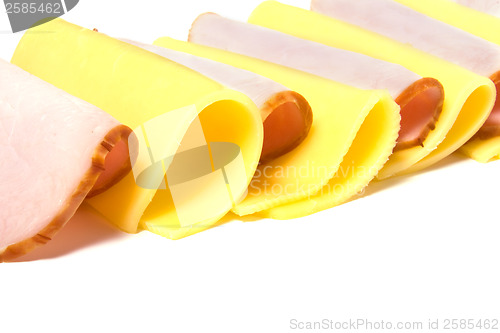 Image of meat and cheese slices isolated on white 