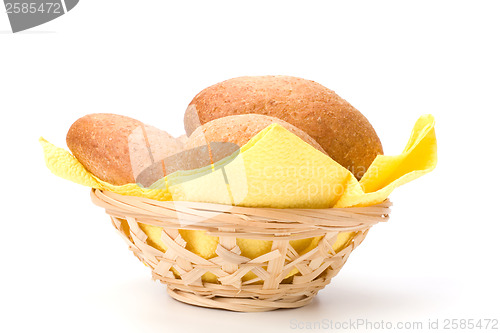 Image of fresh warm rolls in breadbasket isolated on white background