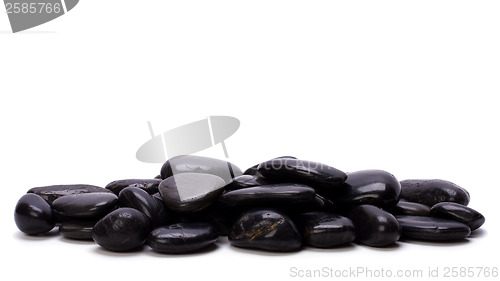 Image of Heap of black pebbles isolated on white background