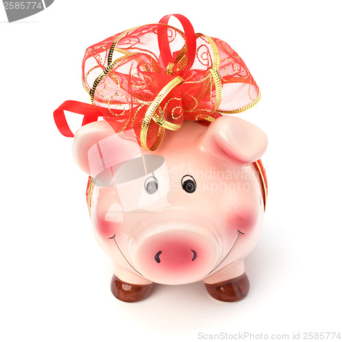 Image of Christmas deposit concept. Piggy bank with festive bow isolated 