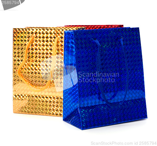 Image of shiny paper gift bags isolated on white background 