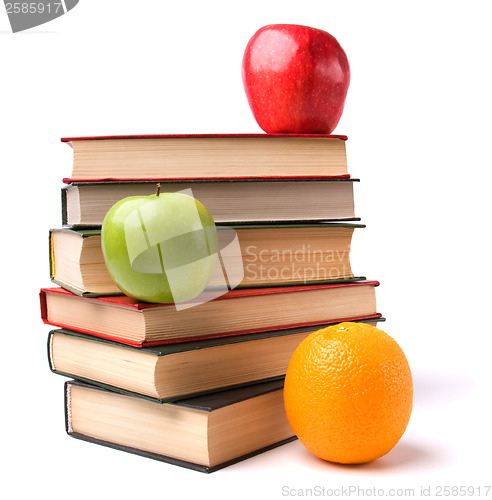 Image of book stack with fruits isolated on white background 