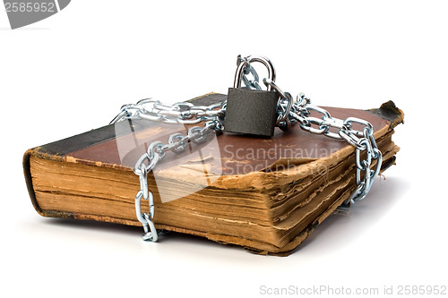 Image of tattered book with chain and padlock isolated on white backgroun