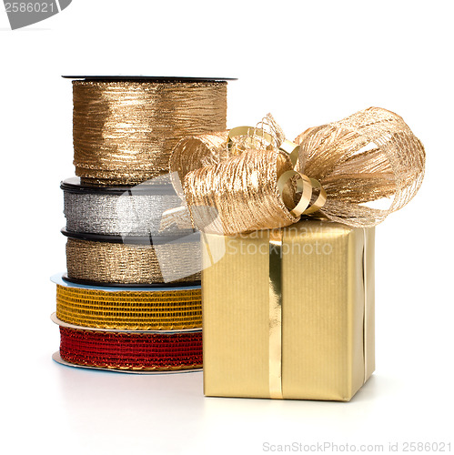 Image of Festive gift box and wrapping ribbons isolated on white backgrou