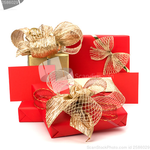 Image of 
Luxurious gifts with note isolated on white background 
