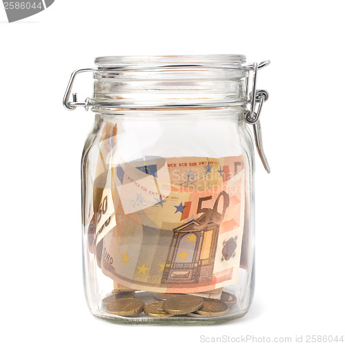 Image of Business concept. Money savings in glass pot.