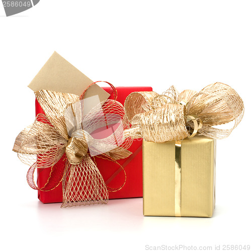 Image of 
Luxurious gifts with note isolated on white background 
