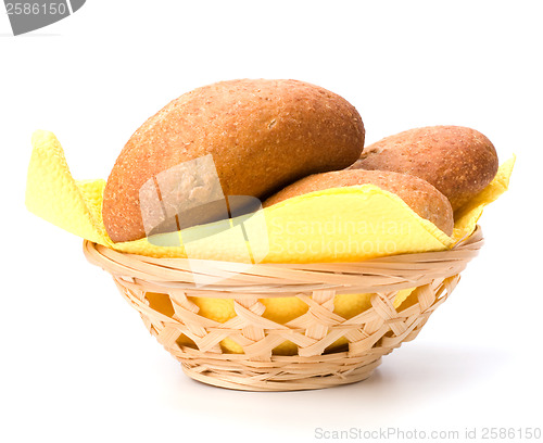 Image of fresh warm rolls in breadbasket isolated on white background