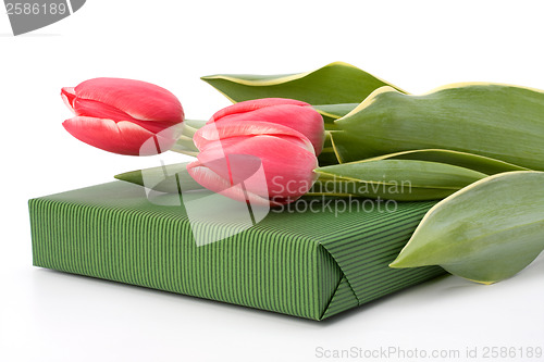 Image of gift with pink tulips  isolated on white background