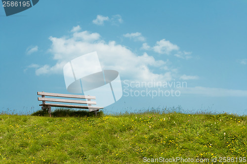 Image of Bench on sky background. Tranquil scene.