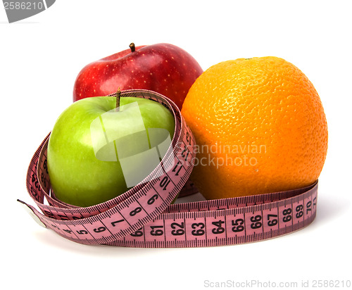 Image of  tape measure wrapped around fruits isolated on white background