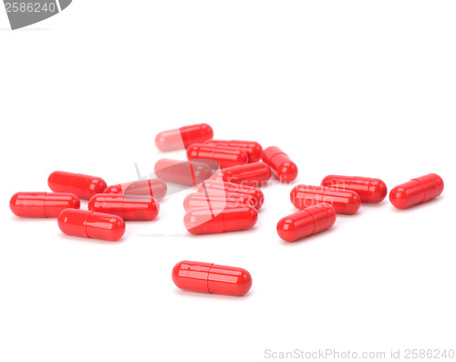 Image of red capsules isolated on white background