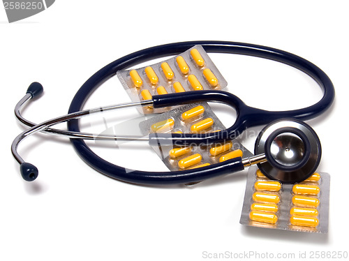 Image of stethoscope and tablets isolated on white background